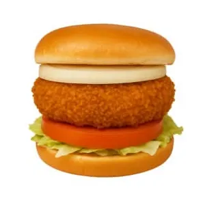 Crispy chicken burger with lettuce, tomato and onion on a soft bun